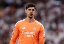 Courtois Absen di El Clasico karena Flu, Lunin Jadi Starter Thibaut Courtois mengenakan seragam kiper Real Madrid berwarna oranye